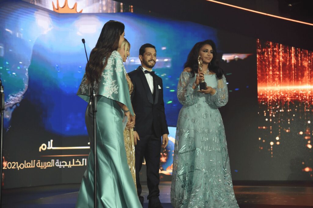 Presenting awards to Ahlam
